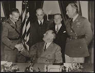 President Roosevelt congratulates Captain Orvil A. Anderson, Captain Albert W. Stevens and others at the White House on November 14, 1935